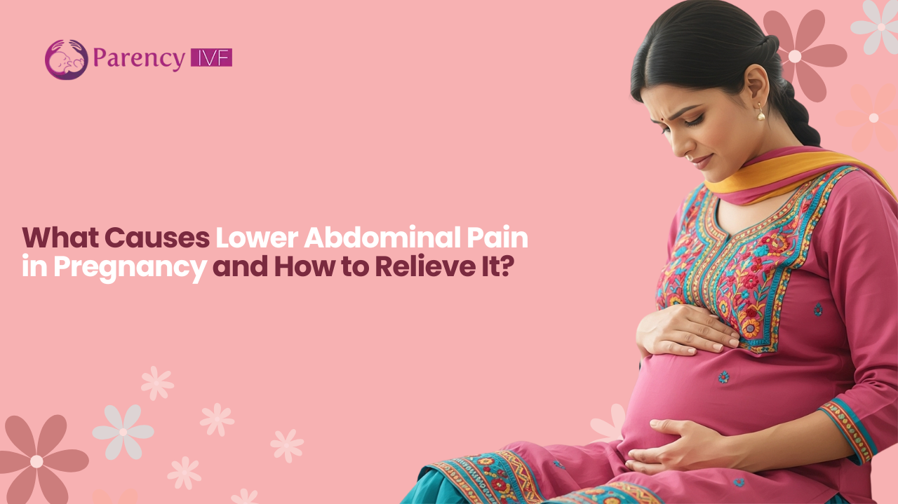 An expectant Indian mother holds her lower abdomen, experiencing pregnancy discomfort from abdominal pain.